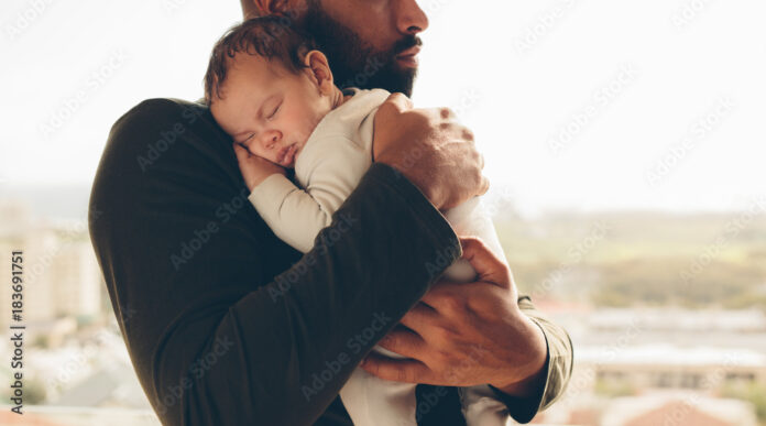 newborn-baby-boy-in-his-fathers-arms-stockpack-adobe-stock Newborn baby boy in his father's arms